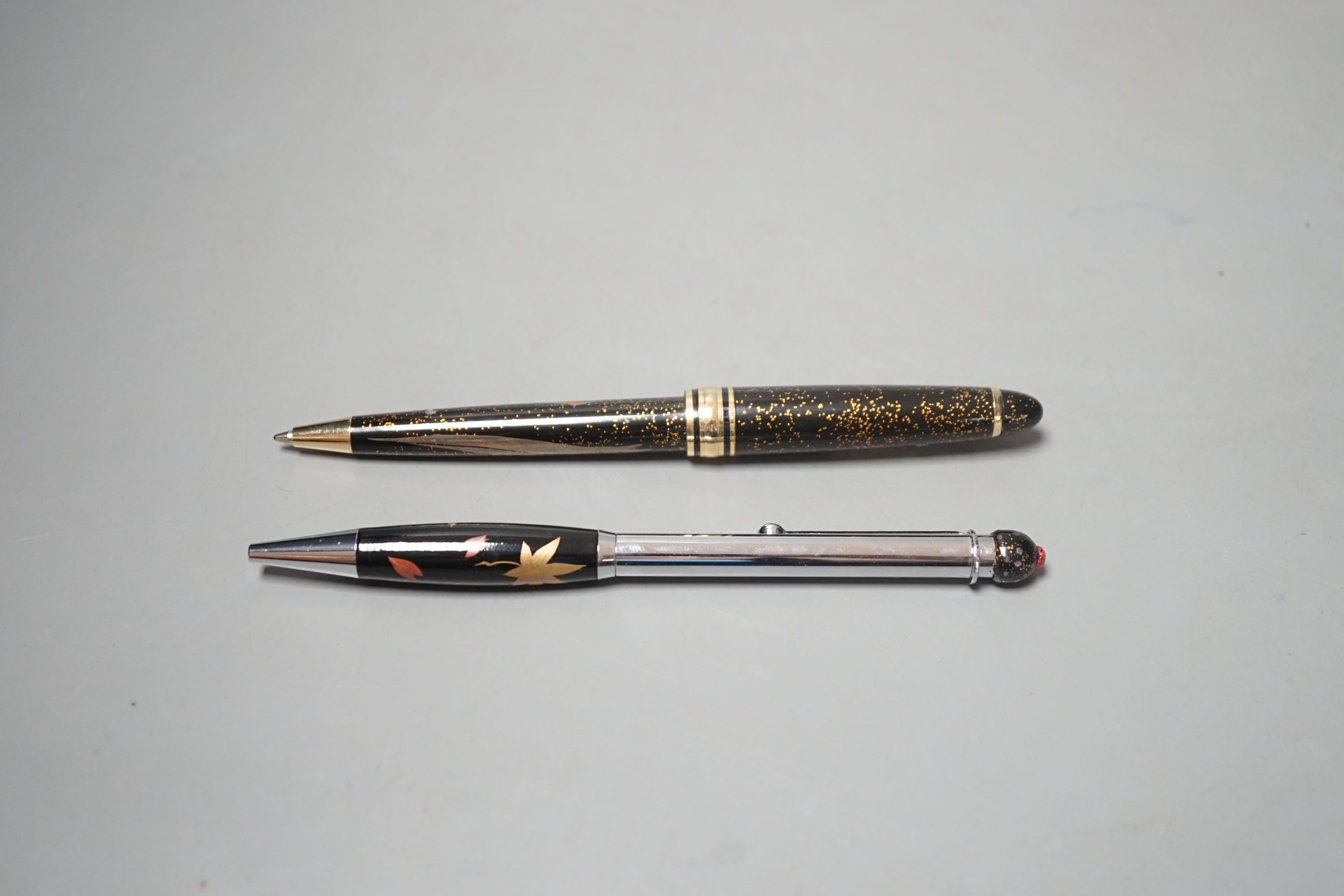 Two Japanese Namiki type Maki-e lacquer ballpoint pens